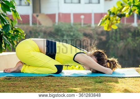 Happy Asian Armless Woman Warming Up Before Swimming At The Tropical Beach