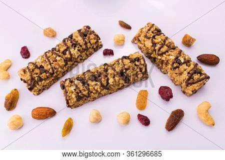 Granola Bars. A Healthy Sweet Snack. Cereal Granola Bar With Nuts And Raisins On A White Background.