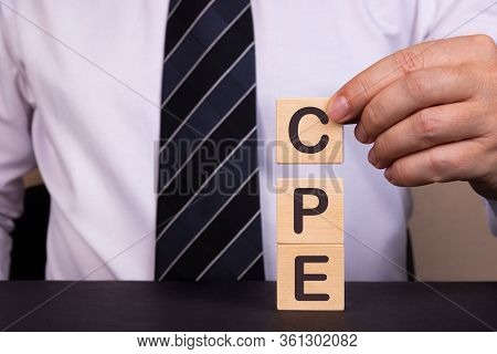 Man Made Word, Text Acronym Cpe Cost Per Engagement With Wood Blocks. Concept.