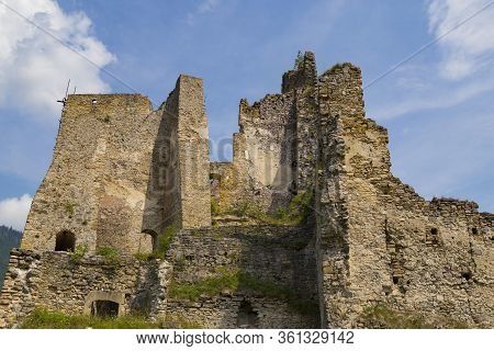 Scenic Ruins Of Ancient Castle  Likava Outside On Blue Cloudy Sky Background. Liptov Region. Slovaki