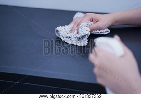 Young Woman Is Holding Spray Bottle, Rag To Clean, Wipe Down Office Metal Cabinet Shelf Accommodatio