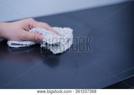 Young Woman Is Holding Spray Bottle, Rag To Clean, Wipe Down Office Metal Cabinet Shelf Accommodatio