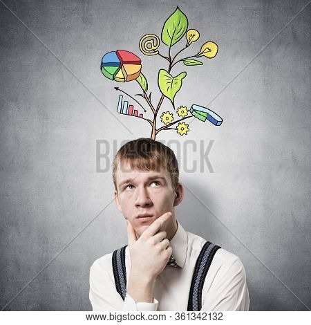 Redhead Student Looks Pensive Upwards And Thinking About Some Genius Idea. Clever Boy With Drawing I
