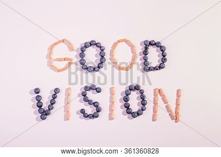 Vitamins And Supplements For Healthy Eyes On Pink Background. How To Maintain Good Vision Concept. B