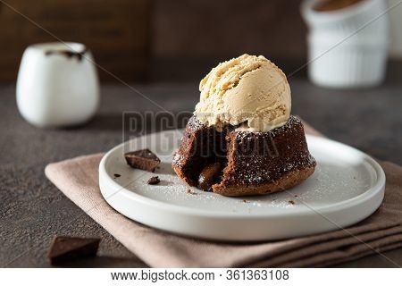 Chocolate Lava Cake With Ice Cream Served On Plate On Dark Background. Confectionery, Cafe, Restaura
