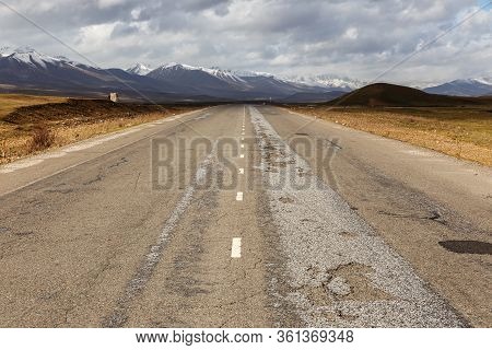 Asphalt Road, Bishkek Osh Highway In Suusamyr Valley Of Kyrgyzstan.