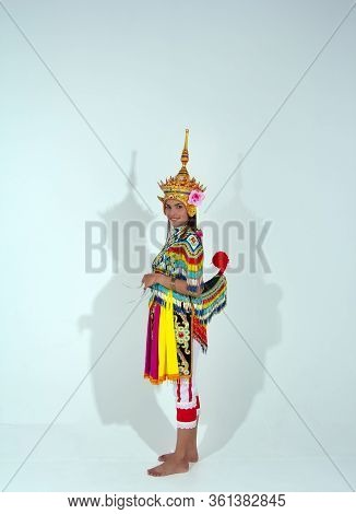 The Beautiful Woman Wearing Thai Tradition Southern Costume And Put Headdress On Her Head,standing O