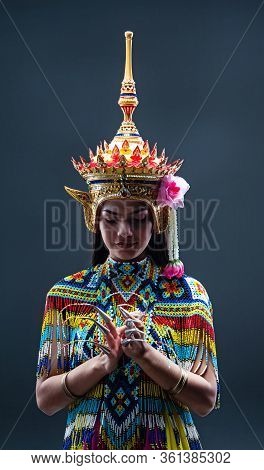 Young Lady Wearing Thai Tradition Southern Costume ,made From Colorful Beads,put Headdress On Her He