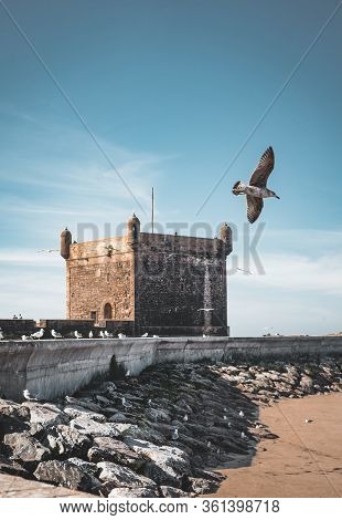 Sqala Du Port, A Defensive Tower At The Fishing Port Of Essaouira, Morocco Near Marrakech. Blue Sky 