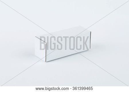 Close Up Of A Small White Cardboard Box , Isolated On White Background