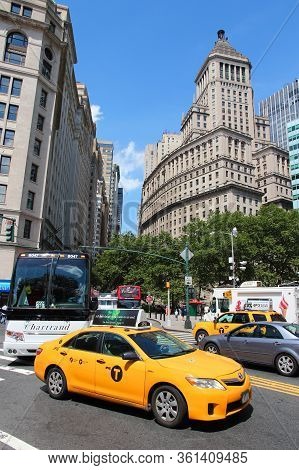 New York, Usa - July 4, 2013: People Ride Yellow Taxi In Lower Manhattan In New York. As Of 2012 The