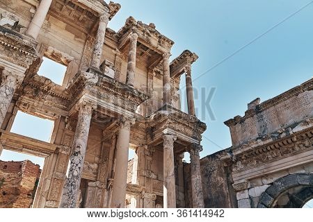 The Ruins Of Celsus Library In Ephesus At Sunny Evening Sun. Beautiful Light Of The Old Ancient Rock