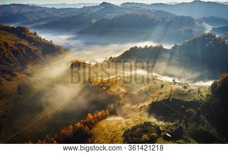 aerial view of Carpathian mountains countryside in autumn morning, Romania