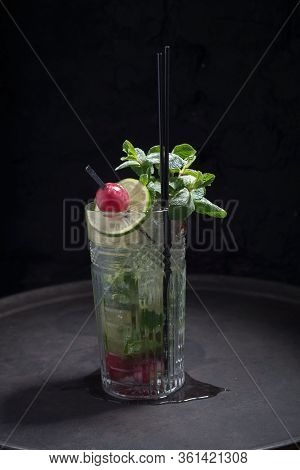 Close-up, Advertising Shot Of A Light Alcoholic Cocktail, With A Sprig Of Mint, Icing Sugar, With De
