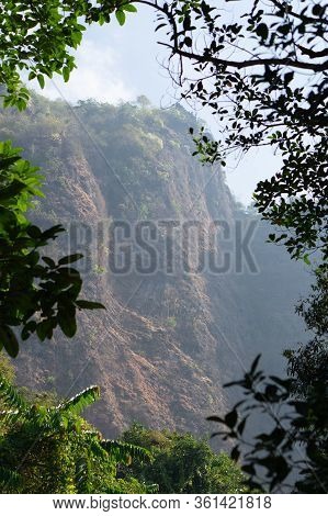 Views Between A Frame Of Trees From Zwe Cabin Mountain. Hpa-an, Myanmar.