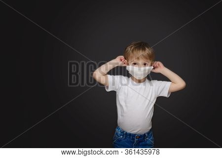 Little Boy In A Medical Mask Not A Gray Background
