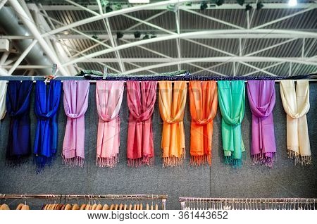 Many Pashmina Foulards Hanging From A Market Stall