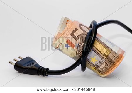 Fifty Euro Money Closed By An Electric Cable With Plug And White Background