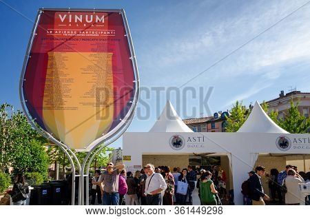 Alba, Italy - April 22, 2017 - Tourists Tasting Asti And Moscato, Traditional Wines Of Piedmont, At 