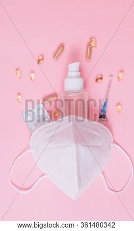Flat Lay Of Medical Mask Kn95, Syringe, Hand Sanitizer Gel, Drops, Pills, Immunomodulating Supplemen