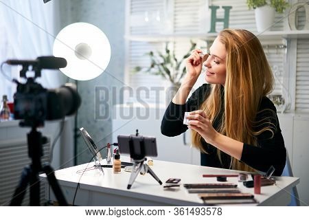 Beauty Blogger Woman Filming Daily Make-up Routine Tutorial At Camera On Tripod. Influencer Girl Liv