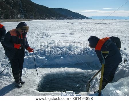 Lake Baikal, Russia - March 12, 2020: Rescue Divers Conduct Training Camps On Lake Baikal. Divers In