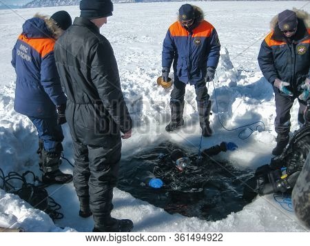 Lake Baikal, Russia - March 12, 2020: Rescue Divers Conduct Training Camps On Lake Baikal. Divers In