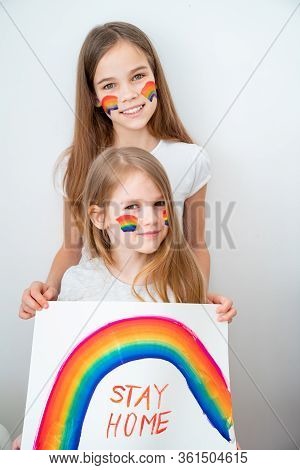 Beautiful Two Kid Girls With Blond Hair Drew A Rainbow And A Poster Stay Home. Flashmob Chasetherain