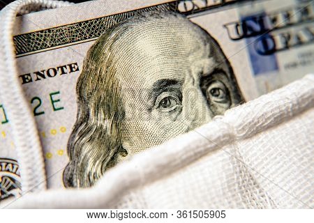 A Hundred-dollar Bill With A Medical Mask .the Concept Of Coronavrius Epidemic