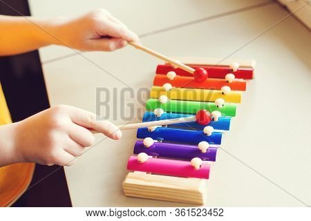 Child Playing With Xylophone, Close Up. Musical Education And Development. Musical Talent. Creativit