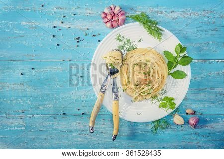 Dish Standing On A Blue Wooden Table, A Plate With Italian Pasta And Chicken With A Sauce Of Provenc