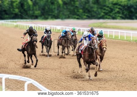 Racetrack Horse Racing Jockey Approaching The Finish Line, Sports With Horses, Riding A Stallion