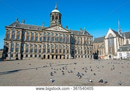 City scenic from Amsterdam at the Dam Square with the Royal Palace in the Netherlands