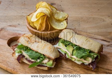 Ciabatta Baguette Sandwiches With Ham, Avocado And Vegetales.