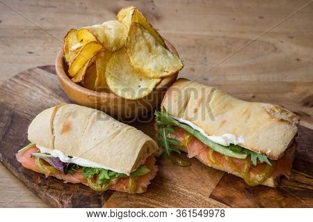 Ciabatta Baguette Sandwiches With Salmon And Vegetales.