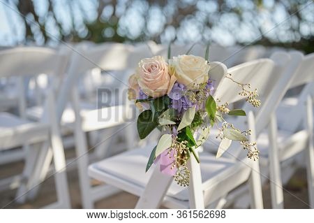 Wedding Decoration Flower Arraignment On White Chair Outdoor Setting