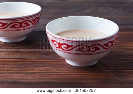 Tea Of National Cuisine In Kesa With A Traditional Pattern, On A Dark Wooden Table. Bashkir Cuisine,