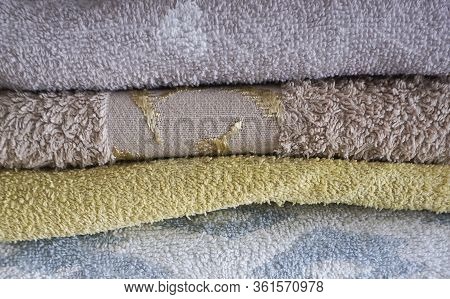 Stack Of Multicolored Towels Neatly Folded Photo