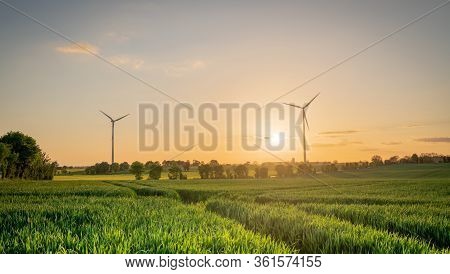 Wind Turbine Sunset Over The Fields Of France