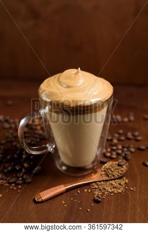 Cold Dalgona Coffee In Clear Glasses On A Dark Wooden Background. Froth Of Sugar And Instant Coffee