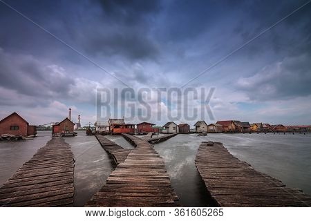 Bokod Floating Village With Piers And Fishing Wooden Cottages, In One Windy Morning. Bokod Lake, Hun