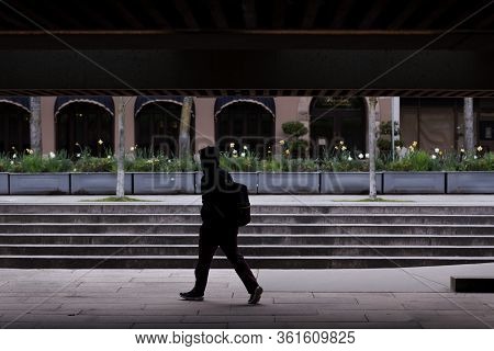Downtown Vancouver, Bc, Canada - Apr 01, 2020: Pedestrian In Downtown Vancouver Wearing A Medical Fa