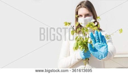 Stay At Home. Covid-19 Quarantine. A Girl In Protective Mask And Gloves Blocks Corona Virus. Social 