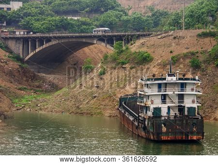 Baidicheng, China - May 7, 2010: Qutang Gorge On Yangtze River. Filthy Empty Bulk Carrier Boat Moore