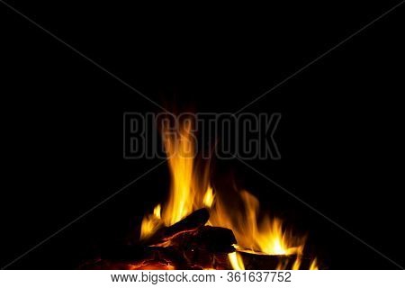 Burning Wood Logs In The Fireplace Close Up. Barbeque Fire. Charcoal And Burning Wood Background. Fi