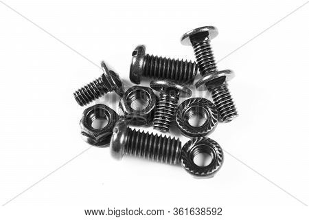 Black Metal Bolts And Nuts  In A Row. Black Screw Bolts And Nuts Isolated. Steel Bolts And Nuts Patt