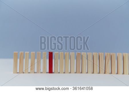 Wooden Empty Blocks With One Red Plank, Copy Space. Uniqueness And Originality. Not Like Everyone. S