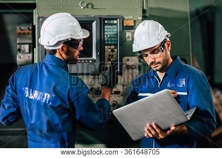 Industry Engineer Team Worker Operate Control Heavy Machine With Computer Laptop To Help Analysis Op