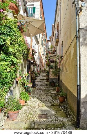 A Narrow Street Between The Old Houses Of Atina, A Medieval Village In The Province Of Frosinone