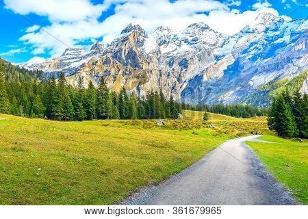 Bernese Alps Snow Peaks And Green Pine Trees Panorama Near Kandersteg Village, Canton Bern, Switzerl